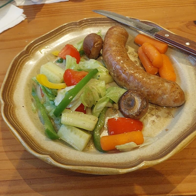 Sausage with salad and vegetables
